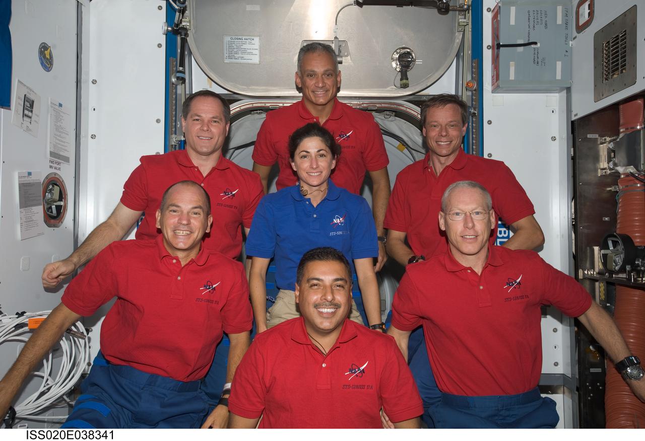 ISS020-E-038341 (5 Sept. 2009) --- The STS-128 crewmembers found a few moments on a day between two spacewalk days to pose for some portraits on the International Space Station. Pictured on the front row, from the left, are astronauts Rick Sturckow, commander; Jose Hernandez and Patrick Forrester, both mission specialists. In the middle of the "clock" arrangement is astronaut Nicole Stott, an Expedition 20 flight engineer who came up to the orbital outpost with this crew. In the back, from left, are astronauts Kevin Ford, pilot, and John "Danny" Olivas, with European Space Agency astronaut Christer Fuglesang, both mission specialists.