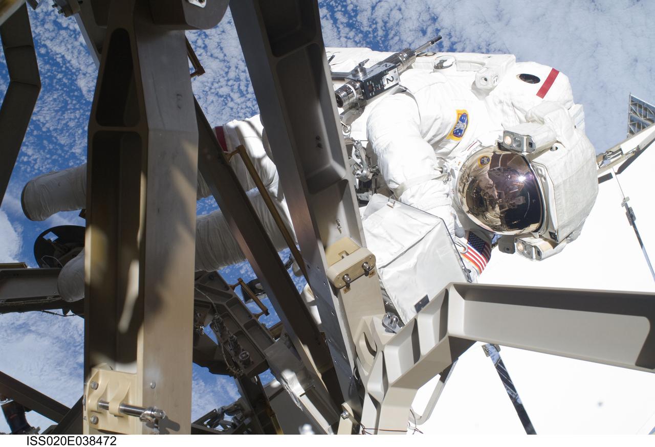 ISS020-E-038472 (5 Sept. 2009) --- NASA astronaut John ?Danny? Olivas, STS-128 mission specialist, participates in the mission's third and final session of extravehicular activity (EVA) as construction and maintenance continue on the International Space Station. During the seven-hour, one-minute spacewalk, Olivas and European Space Agency astronaut Christer Fuglesang (out of frame), mission specialist, deployed the Payload Attachment System (PAS), replaced the Rate Gyro Assembly #2, installed two GPS antennae and did some work to prepare for the installation of Node 3 next year. During connection of one of two sets of avionics cables for Node 3, one of the connectors could not be mated. This cable and connector were wrapped in a protective sleeve and safed. All other cables were mated successfully.