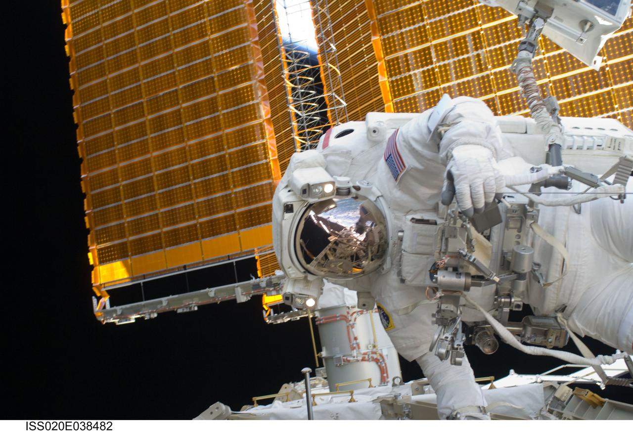 ISS020-E-038482 (5 Sept. 2009) --- NASA astronaut John ?Danny? Olivas, STS-128 mission specialist, participates in the mission's third and final session of extravehicular activity (EVA) as construction and maintenance continue on the International Space Station. Visible in the reflections of his helmet visor are various components of the station, Earth's horizon and European Space Agency astronaut Christer Fuglesang, mission specialist. During the seven-hour, one-minute spacewalk, Olivas and Fuglesang deployed the Payload Attachment System (PAS), replaced the Rate Gyro Assembly #2, installed two GPS antennae and did some work to prepare for the installation of Node 3 next year. During connection of one of two sets of avionics cables for Node 3, one of the connectors could not be mated. This cable and connector were wrapped in a protective sleeve and safed. All other cables were mated successfully.