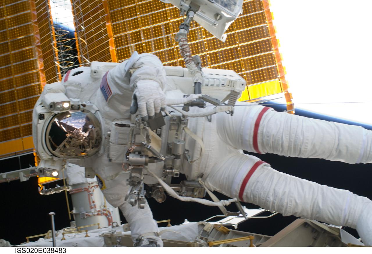 ISS020-E-038483 (5 Sept. 2009) --- NASA astronaut John ?Danny? Olivas, STS-128 mission specialist, participates in the mission's third and final session of extravehicular activity (EVA) as construction and maintenance continue on the International Space Station. Visible in the reflections of his helmet visor are various components of the station, Earth's horizon and European Space Agency astronaut Christer Fuglesang, mission specialist. During the seven-hour, one-minute spacewalk, Olivas and Fuglesang deployed the Payload Attachment System (PAS), replaced the Rate Gyro Assembly #2, installed two GPS antennae and did some work to prepare for the installation of Node 3 next year. During connection of one of two sets of avionics cables for Node 3, one of the connectors could not be mated. This cable and connector were wrapped in a protective sleeve and safed. All other cables were mated successfully.