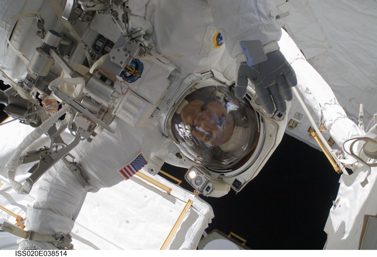 ISS020-E-038514 (5 Sept. 2009) --- NASA astronaut John ?Danny? Olivas, STS-128 mission specialist, participates in the mission's third and final session of extravehicular activity (EVA) as construction and maintenance continue on the International Space Station. During the seven-hour, one-minute spacewalk, Olivas and European Space Agency astronaut Christer Fuglesang (out of frame), mission specialist, deployed the Payload Attachment System (PAS), replaced the Rate Gyro Assembly #2, installed two GPS antennae and did some work to prepare for the installation of Node 3 next year. During connection of one of two sets of avionics cables for Node 3, one of the connectors could not be mated. This cable and connector were wrapped in a protective sleeve and safed. All other cables were mated successfully.