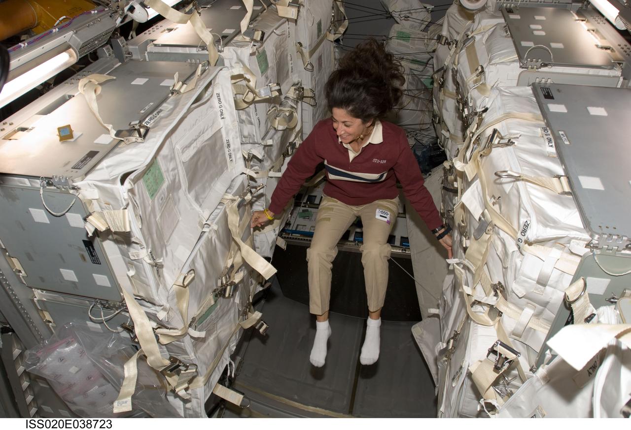 ISS020-E-038723 (5 Sept. 2009) --- NASA astronaut Nicole Stott, Expedition 20 flight engineer, is pictured in the Leonardo Multi-Purpose Logistics Module (MPLM), temporarily attached to the International Space Station while Space Shuttle Discovery (STS-128) remains docked with the station.