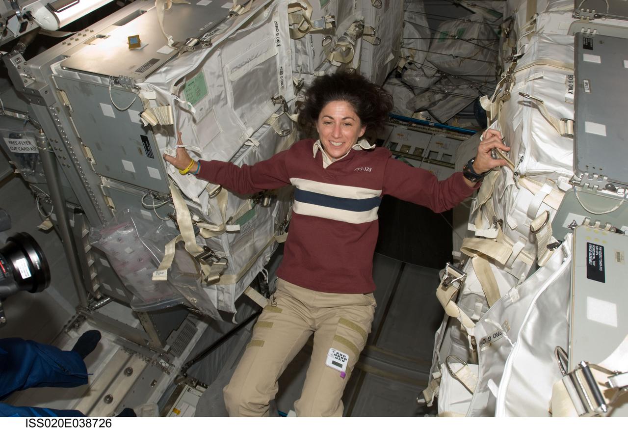 ISS020-E-038726 (5 Sept. 2009) --- NASA astronaut Nicole Stott, Expedition 20 flight engineer, is pictured in the Leonardo Multi-Purpose Logistics Module (MPLM), temporarily attached to the International Space Station while Space Shuttle Discovery (STS-128) remains docked with the station.