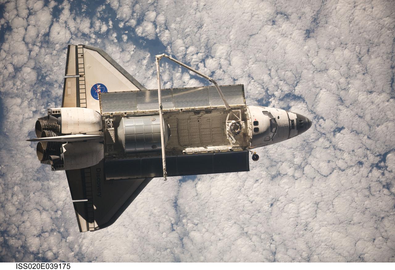 ISS020-E-039175 (8 Sept. 2009) --- Backdropped by a cloud-covered part of Earth, Space Shuttle Discovery (STS-128) is featured in this image photographed by an Expedition 20 crew member on the International Space Station soon after the shuttle and station began their post-undocking relative separation. Undocking of the two spacecraft occurred at 2:26 p.m. (CDT) on Sept. 8, 2009. The Leonardo Multi-Purpose Logistics Module is visible in Discovery’s cargo bay.
