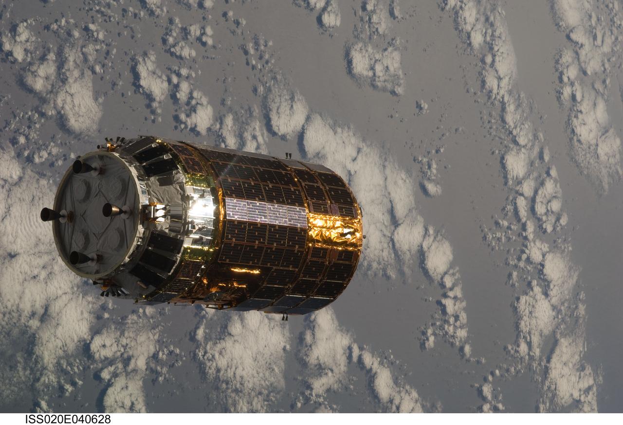 ISS020-E-040628 (17 Sept. 2009) --- Backdropped by a scattering of clouds over part of Earth, the unpiloted Japanese H-II Transfer Vehicle (HTV) approaches the International Space Station. Once the HTV was in range, NASA astronaut Nicole Stott, Canadian Space Agency astronaut Robert Thirsk and European Space Agency astronaut Frank De Winne, all Expedition 20 flight engineers, used the station’s robotic arm to grab the cargo craft and attach it to the Earth-facing port of the Harmony node. The attachment was completed at 5:26 (CDT) on Sept. 17, 2009.