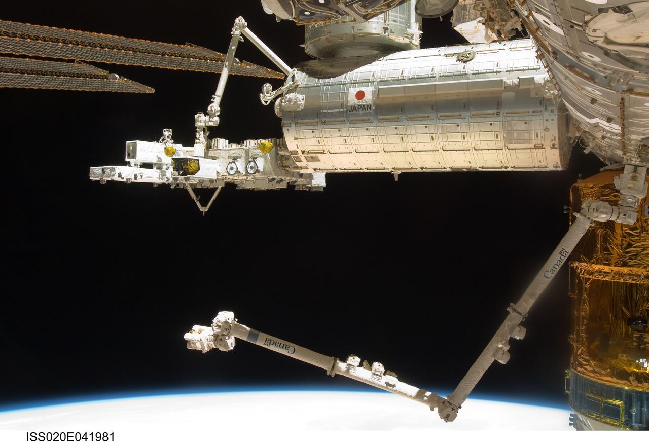ISS020-E-041981 (24 Sept. 2009) --- The exterior of the Japanese Kibo complex of the International Space Station and the station's Canadarm2 (bottom) are featured in this image photographed by an Expedition 20 crew member on the station. European Space Agency astronaut Frank De Winne and NASA astronaut Nicole Stott, both Expedition 20 flight engineers, used the controls of the Japanese Experiment Module Robotic Manipulator System (JEM-RMS) in Kibo to grapple and transfer two Japanese payloads from the Exposed Pallet to their Exposed Facility locations -- first HICO/Hyperspectral Imager for the Coastal Ocean & RAIDS/Remote Atmospheric and Ionospheric Detection System (HREP), then Superconducting Submillimeter-wave Limb-emission Sounder (SMILES).