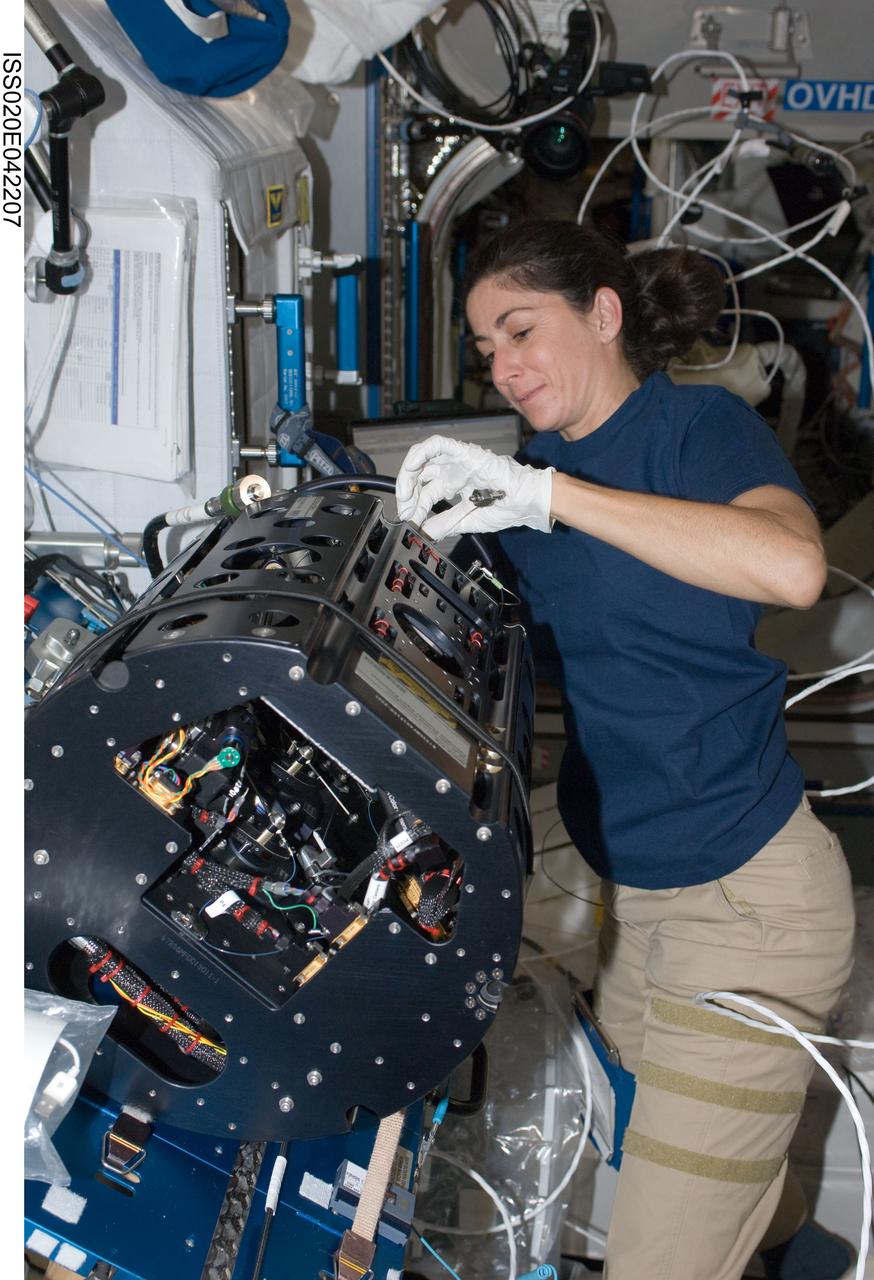 ISS020-E-042207 (26 Sept. 2009) --- NASA astronaut Nicole Stott, Expedition 20 flight engineer, works with the Combustion Integrated Rack (CIR) in the Destiny laboratory of the International Space Station.
