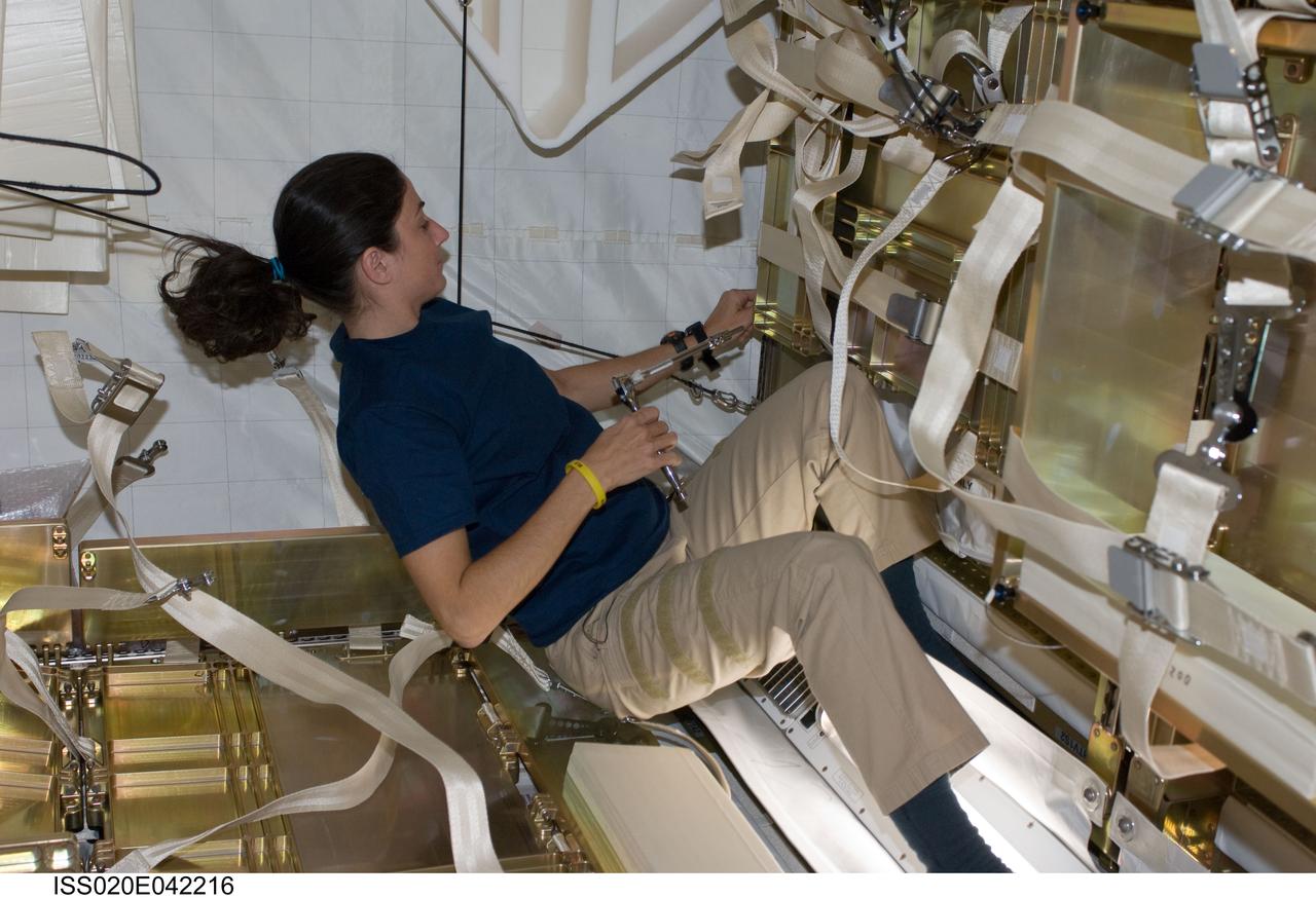 ISS020-E-042216 (26 Sept. 2009) --- NASA astronaut Nicole Stott, Expedition 20 flight engineer, works in the Japanese H-II Transfer Vehicle (HTV) docked to the International Space Station.