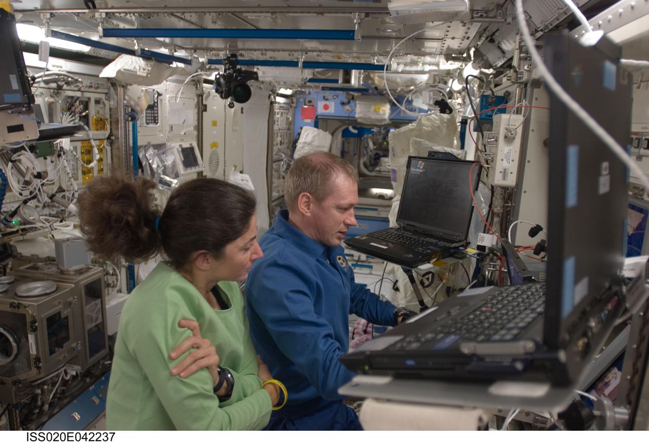 ISS020-E-042237 (23 Sept. 2009) --- NASA astronaut Nicole Stott and European Space Agency astronaut Frank De Winne, both Expedition 20 flight engineers, work the controls of the JEM Robotic Manipulator System (JEM-RMS) in the Kibo laboratory of the International Space Station. De Winne and Stott used the JEM-RMS to grapple the Exposed Pallet (EP) from the station’s Canadarm2 and berth it to the JEM Exposed Facility / Exposed Facility Unit 10 (JEF EFU10).