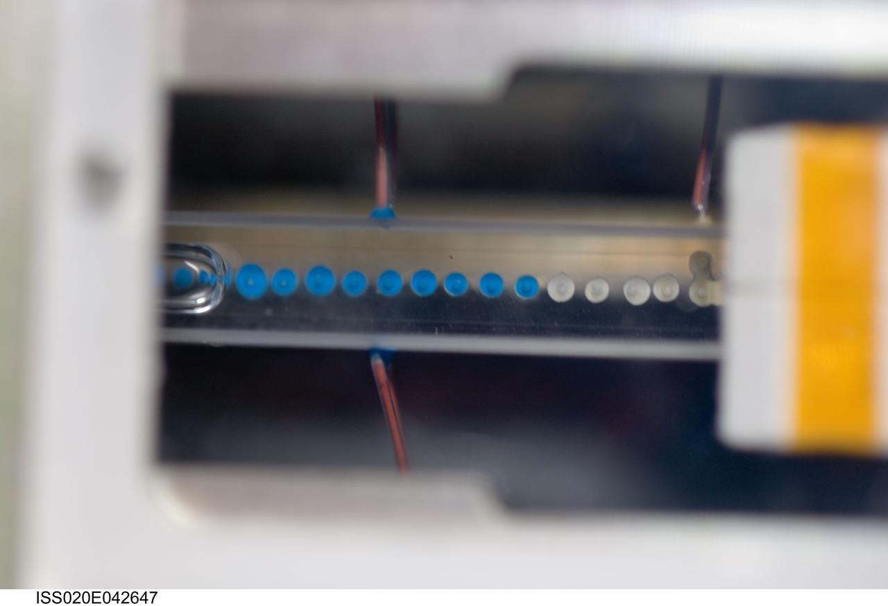 iss020e042647 (Sep. 26, 2009) --- Constrained Vapor Bubble (CVB) module with the science sample on the Fluids Integrated Rack (FIR). CVB  aims to better understand the physics of evaporation and condensation to help create an efficient and highly reliable cooling equipment for space, where replacement parts are difficult or impossible.