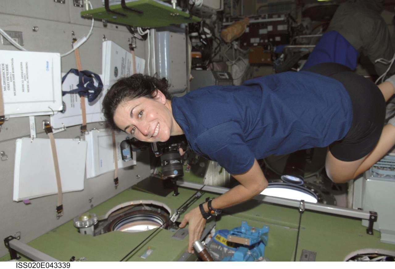 ISS020-E-043339 (28 Sept. 2009) --- NASA astronaut Nicole Stott, Expedition 20 flight engineer, is pictured near a window in the Zvezda Service Module of the International Space Station.