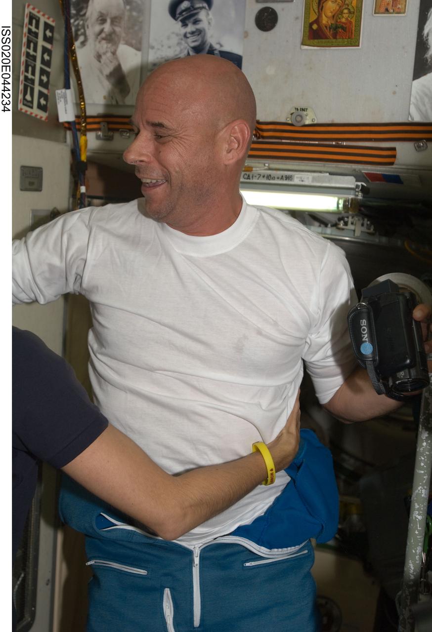 ISS020-E-044234 (2 Oct. 2009) --- Spaceflight participant Guy Laliberte is pictured in the Zvezda Service Module of the International Space Station, shortly after arriving onboard a Soyuz spacecraft with two Expedition 21 crew members (out of frame).