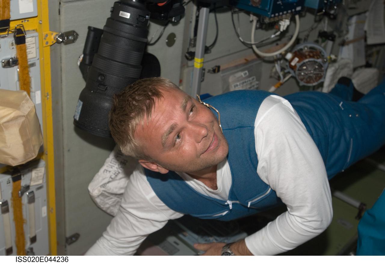 ISS020-E-044236 (2 Oct. 2009) --- Russian cosmonaut Maxim Suraev, Expedition 21 flight engineer, is pictured in the Zvezda Service Module of the International Space Station, shortly after arriving onboard a Soyuz spacecraft with NASA astronaut Jeffrey Williams, Expedition 21 flight engineer and spaceflight participant Guy Laliberte (both out of frame).