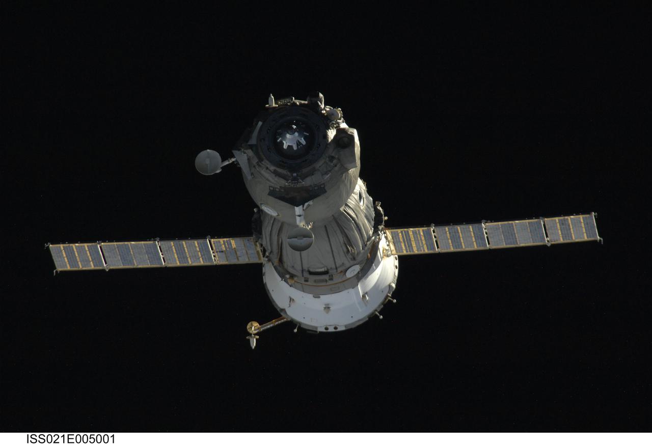 ISS021-E-005001 (11 Oct. 2009) --- Backdropped by the blackness of space, the Soyuz TMA-14 spacecraft departs from the International Space Station carrying Russian cosmonaut Gennady Padalka, Expedition 19/20 commander and Soyuz commander; NASA astronaut Michael Barratt, flight engineer; and spaceflight participant Guy Laliberte. Padalka guided the spacecraft to a parachute-assisted landing at 10:32 a.m. (Kazakhstan time) on Oct. 11, 2009, near the town of Arkalyk, Kazakhstan.