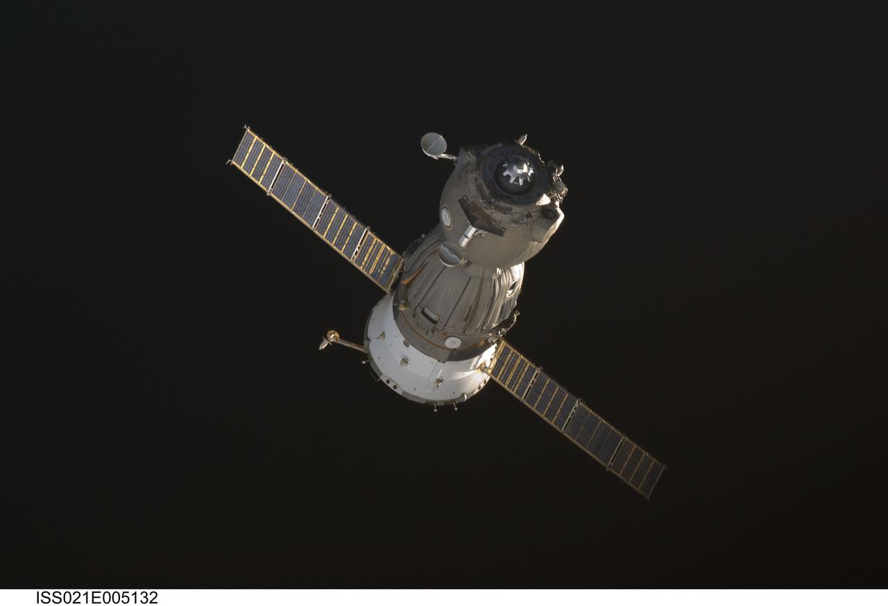 ISS021-E-005132 (11 Oct. 2009) --- Backdropped by the blackness of space, the Soyuz TMA-14 spacecraft departs from the International Space Station carrying Russian cosmonaut Gennady Padalka, Expedition 19/20 commander and Soyuz commander; NASA astronaut Michael Barratt, flight engineer; and spaceflight participant Guy Laliberte. Padalka guided the spacecraft to a parachute-assisted landing at 10:32 a.m. (Kazakhstan time) on Oct. 11, 2009, near the town of Arkalyk, Kazakhstan.