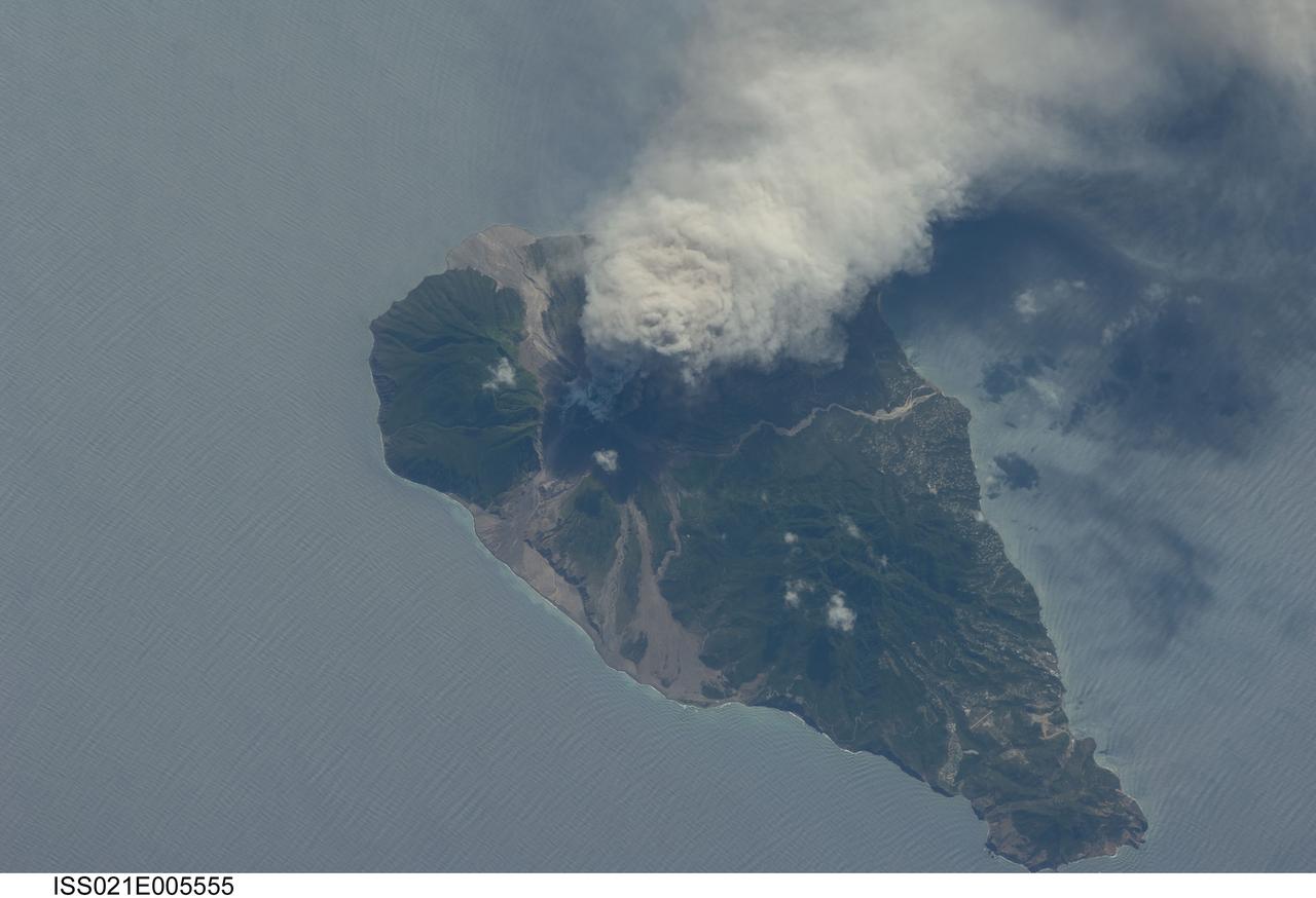 ISS021-E-005555 (11 Oct. 2009) --- This picture of the active Soufriere Hills volcano on Montserrat Island was photographed on Oct. 11, 2009 by the Expedition 21 crew members onboard the International Space Station.   Meteorologists and other scientists note that this area is nearly always cloudy so it is considered rare when astronauts get good images of the plumes or volcanic activity. Soufriere Hills is identified as a "stratovolcano" by geologists because it is built of layers (the “strato” part of the name) of both lavas and pyroclastic flows from older eruptions. Another name for this kind of volcano is a "composite volcano" referring to the fact that when it erupts it produces both lava and fragmented deposits during explosive eruptions. Scientists point out that the magma feeding the Soufriere Hills volcano is created by the subduction of local tectonic plates – stratovolcanoes are commonly associated with this type of geologic environment. Photo credit: NASA