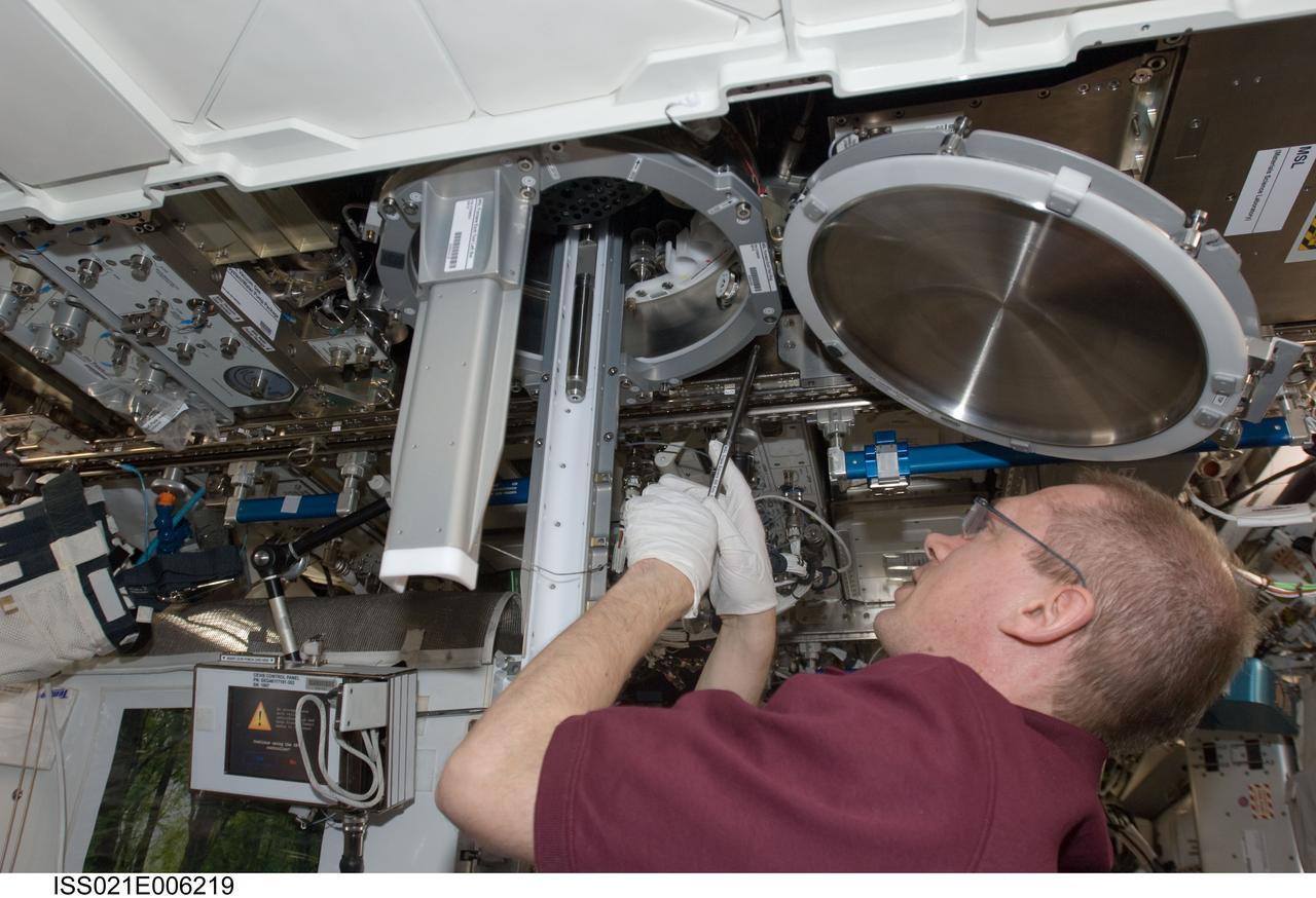 ISS021-E-006219 (14 Oct. 2009) --- European Space Agency astronaut Frank De Winne, Expedition 21 commander, works with Materials Science Laboratory (MSL) hardware in the Destiny laboratory of the International Space Station.