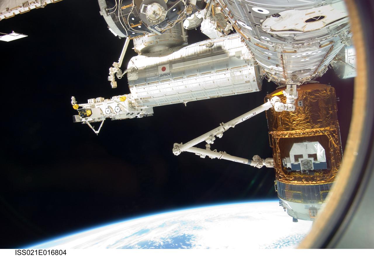 ISS021-E-016804 (30 Oct. 2009) --- Backdropped by Earth’s horizon and the blackness of space, the International Space Station's Canadarm2 grapples the unpiloted Japanese H-II Transfer Vehicle (HTV) in preparation for its release from the station. European Space Agency astronaut Frank De Winne, Expedition 21 commander; NASA astronaut Nicole Stott and Canadian Space Agency astronaut Robert Thirsk, both flight engineers, used the station’s robotic arm to grab the HTV cargo craft, filled with trash and unneeded items, and unberth it from the Harmony node’s nadir port. The HTV was successfully unberthed at 10:18 a.m. (CDT) on Oct. 30, 2009, and released from the station’s Canadarm2 at 12:32 p.m.