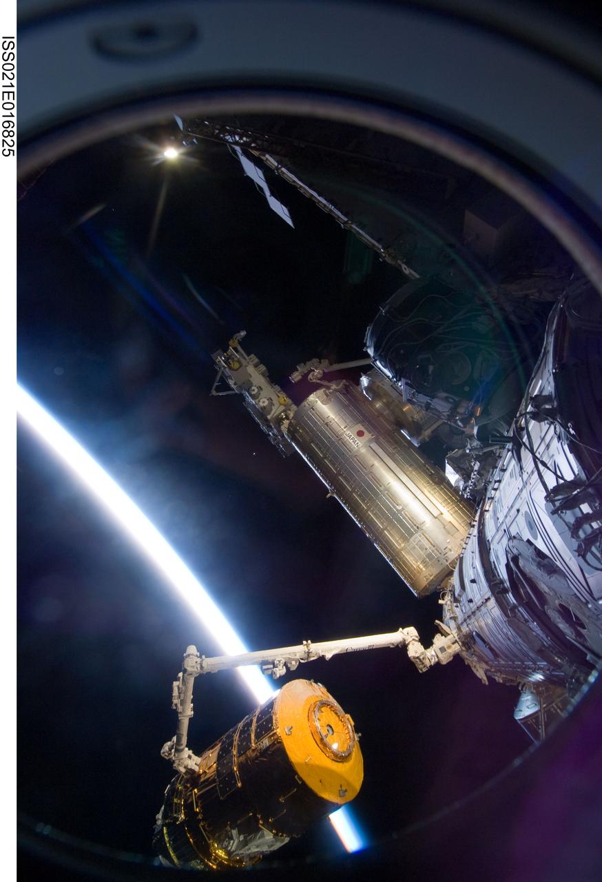 ISS021-E-016825 (30 Oct. 2009) --- Backdropped by the thin line of Earth’s atmosphere and the blackness of space, the International Space Station's Canadarm2 unberths the unpiloted Japanese H-II Transfer Vehicle (HTV) in preparation for its release from the station. European Space Agency astronaut Frank De Winne, Expedition 21 commander; NASA astronaut Nicole Stott and Canadian Space Agency astronaut Robert Thirsk, both flight engineers, used the station’s robotic arm to grab the HTV cargo craft, filled with trash and unneeded items, and unberth it from the Harmony node’s nadir port. The HTV was successfully unberthed at 10:18 a.m. (CDT) on Oct. 30, 2009, and released from the station’s Canadarm2 at 12:32 p.m.