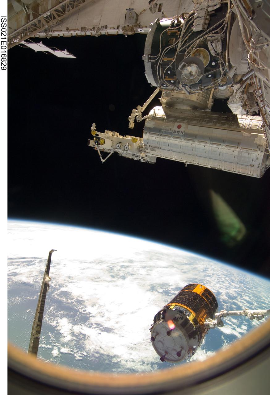 ISS021-E-016829 (30 Oct. 2009) --- Backdropped by Earth’s horizon and the blackness of space, the International Space Station's Canadarm2 unberths the unpiloted Japanese H-II Transfer Vehicle (HTV) in preparation for its release from the station. European Space Agency astronaut Frank De Winne, Expedition 21 commander; NASA astronaut Nicole Stott and Canadian Space Agency astronaut Robert Thirsk, both flight engineers, used the station’s robotic arm to grab the HTV cargo craft, filled with trash and unneeded items, and unberth it from the Harmony node’s nadir port. The HTV was successfully unberthed at 10:18 a.m. (CDT) on Oct. 30, 2009, and released from the station’s Canadarm2 at 12:32 p.m.
