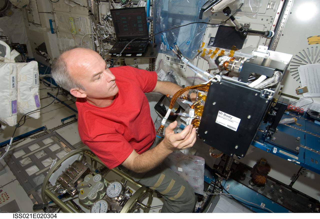 ISS021-E-020304 (5 Nov. 2009) --- NASA astronaut Jeffrey Williams, Expedition 21 flight engineer, works with Fluid Physics Experiment Facility/Marangoni Surface (FPEF MS) Core hardware in the Kibo laboratory of the International Space Station. Williams first inserted the Marangoni Inside (MI) cassette in the MI Core for a leak check, and then installed the MI Core into the FPEF MI Body. The Marangoni convection experiment in the FPEF examines fluid tension flow in micro-G.
