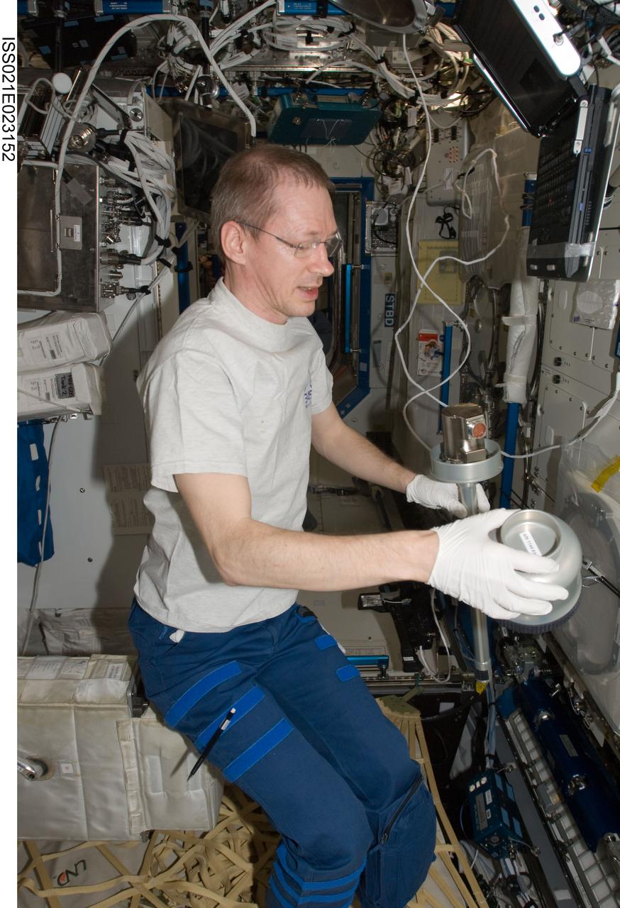 ISS021-E-023152 (8 Nov. 2009) --- European Space Agency astronaut Frank De Winne, Expedition 21 commander, works with Microgravity Science Laboratory (MSL) hardware in the Destiny laboratory of the International Space Station.