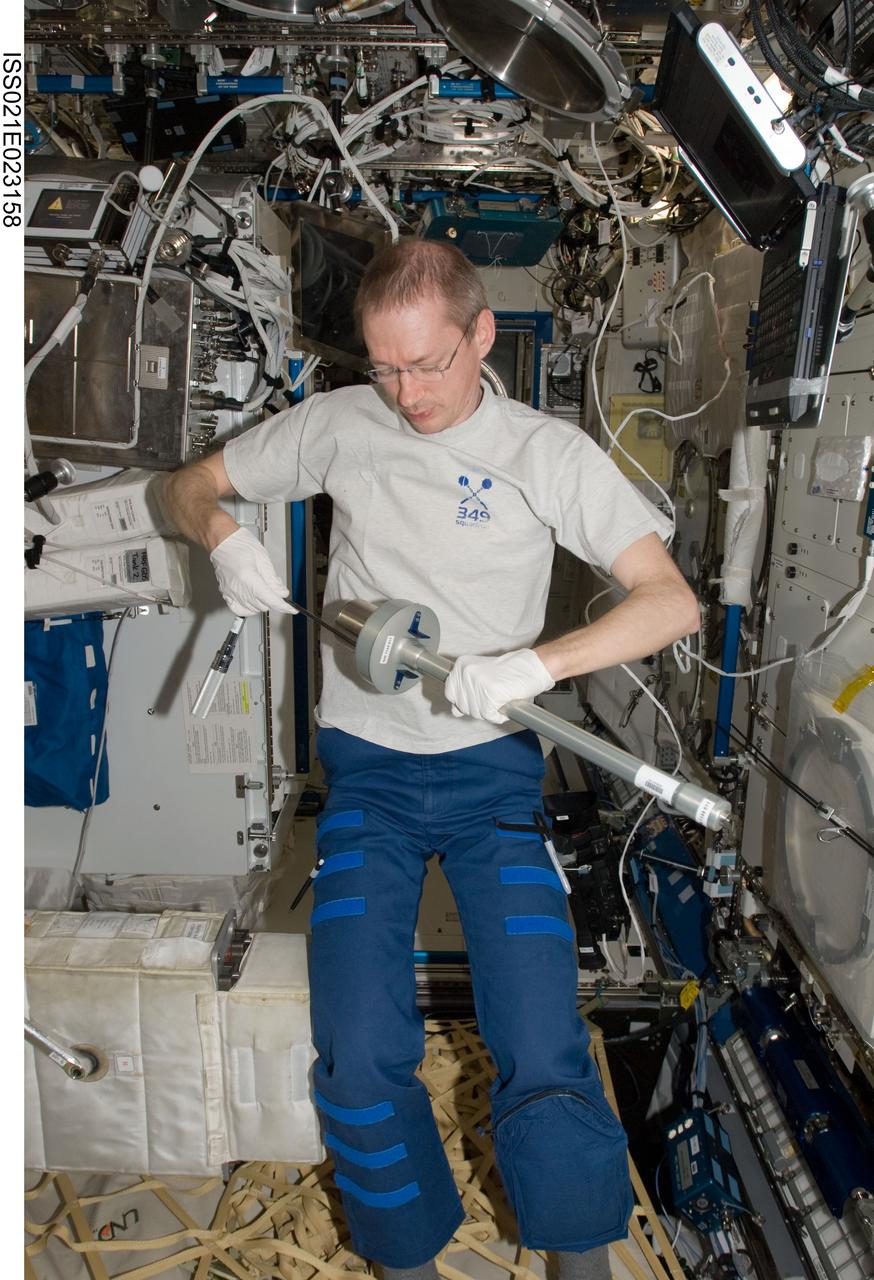 ISS021-E-023158 (8 Nov. 2009) --- European Space Agency astronaut Frank De Winne, Expedition 21 commander, works with Microgravity Science Laboratory (MSL) hardware in the Destiny laboratory of the International Space Station.