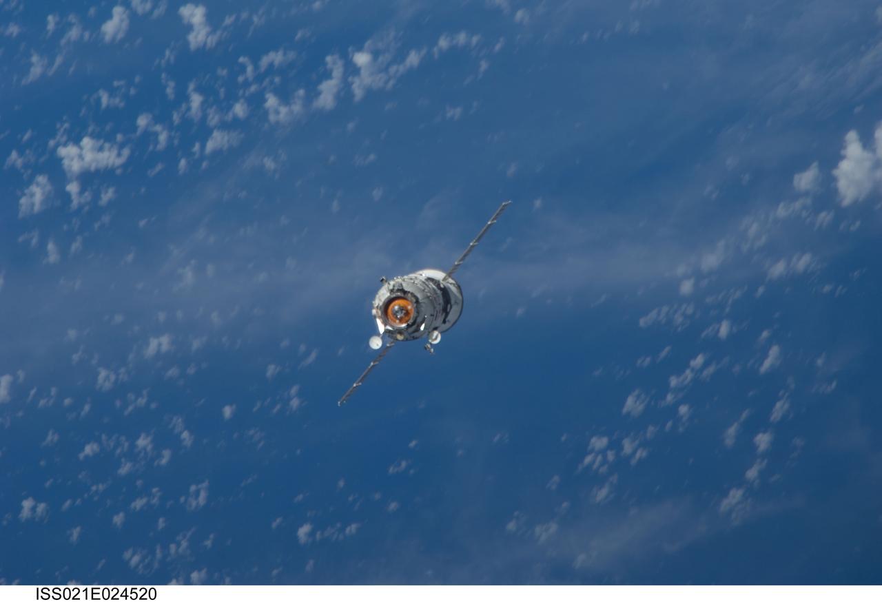 ISS021-E-024520 (12 Nov. 2009) --- Backdropped by a blue and white part of Earth, the new unpiloted Russian Mini-Research Module 2 (MRM2), also known as Poisk, approaches the International Space Station. The MRM2 docked to the space-facing port of the Zvezda Service Module at 9:41 a.m. (CST) on Nov. 12, 2009. It began its trip to the station when it was launched aboard a Soyuz rocket from the Baikonur Cosmodrome in Kazakhstan on Nov. 10. Poisk is a Russian term that translates to search, seek and explore. It will provide an additional docking port for visiting Russian spacecrafts and will serve as an extra airlock for spacewalkers wearing Russian Orlan spacesuits. Poisk joins a Russian Progress resupply vehicle and two Russian Soyuz spacecraft currently docked at the station.
