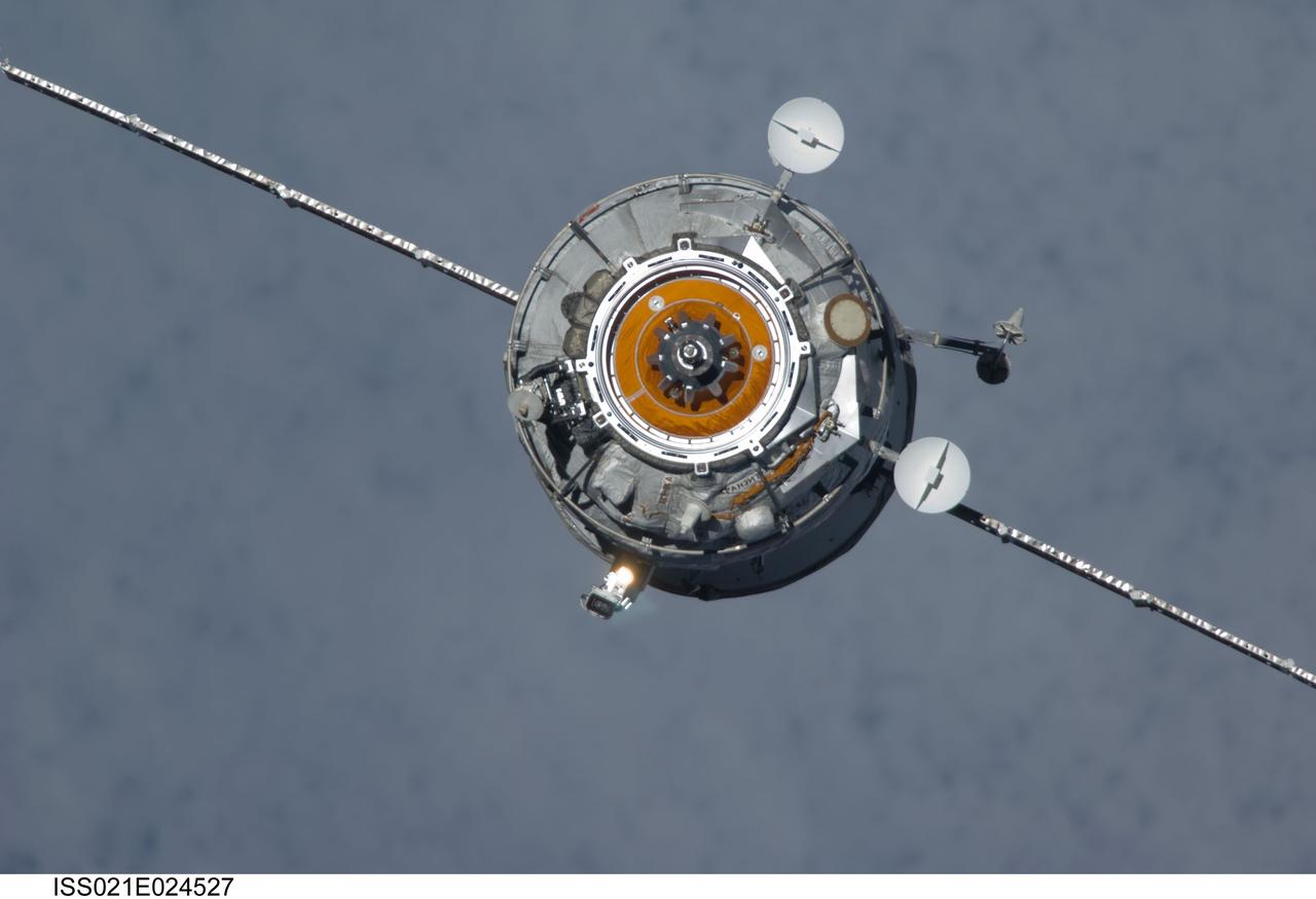 ISS021-E-024527 (12 Nov. 2009) --- The new unpiloted Russian Mini-Research Module 2 (MRM2), also known as Poisk, approaches the International Space Station. The MRM2 docked to the space-facing port of the Zvezda Service Module at 9:41 a.m. (CST) on Nov. 12, 2009. It began its trip to the station when it was launched aboard a Soyuz rocket from the Baikonur Cosmodrome in Kazakhstan on Nov. 10. Poisk is a Russian term that translates to search, seek and explore. It will provide an additional docking port for visiting Russian spacecrafts and will serve as an extra airlock for spacewalkers wearing Russian Orlan spacesuits. Poisk joins a Russian Progress resupply vehicle and two Russian Soyuz spacecraft currently docked at the station.
