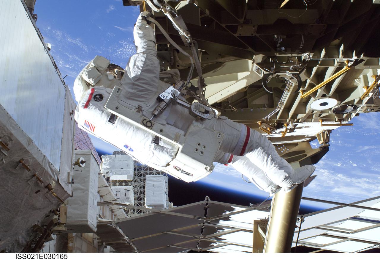 ISS021-E-030165 (19 Nov. 2009) --- Astronaut Mike Foreman, STS-129 mission specialist, participates in the mission's first session of extravehicular activity (EVA) as construction and maintenance continue on the International Space Station. During the six-hour, 37-minute spacewalk, Foreman and astronaut Robert L. Satcher Jr. (out of frame), mission specialist, installed a spare S-band antenna structural assembly to the Z1 segment of the station?s truss, or backbone. Foreman and Satcher also installed a set of cables for a future space-to-ground antenna on the Destiny laboratory and replaced a handrail on the Unity node with a new bracket used to route an ammonia cable that will be needed for the Tranquility node when it is delivered next year. The two spacewalkers also repositioned a cable connector on Unity, checked S0 truss cable connections, and lubricated latching snares on the Kibo robotic arm and the station?s mobile base system.