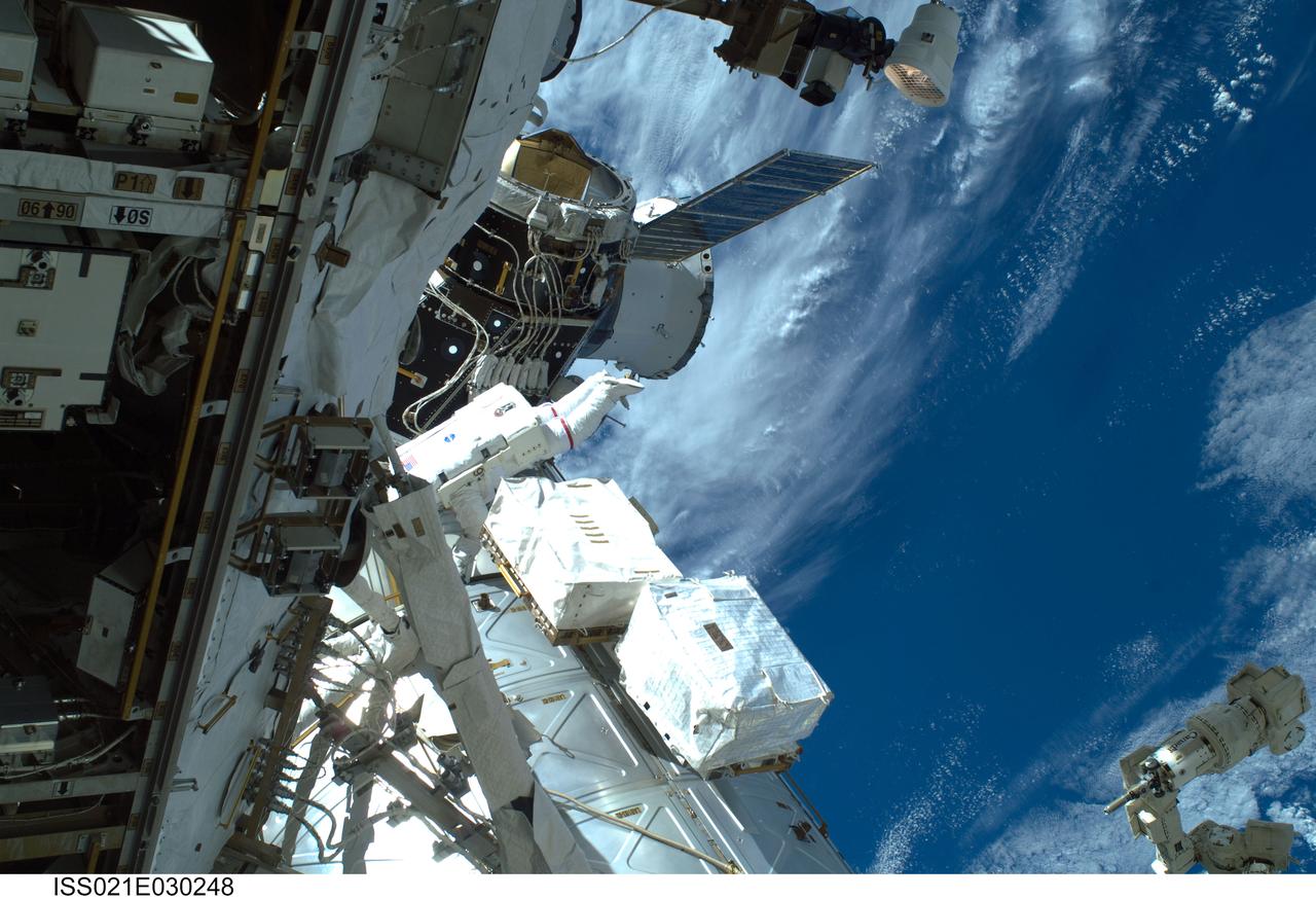 ISS021-E-030248 (19 Nov. 2009) --- Astronaut Mike Foreman, STS-129 mission specialist, participates in the mission's first session of extravehicular activity (EVA) as construction and maintenance continue on the International Space Station. During the six-hour, 37-minute spacewalk, Foreman and astronaut Robert L. Satcher Jr. (out of frame), mission specialist, installed a spare S-band antenna structural assembly to the Z1 segment of the station?s truss, or backbone. Foreman and Satcher also installed a set of cables for a future space-to-ground antenna on the Destiny laboratory and replaced a handrail on the Unity node with a new bracket used to route an ammonia cable that will be needed for the Tranquility node when it is delivered next year. The two spacewalkers also repositioned a cable connector on Unity, checked S0 truss cable connections, and lubricated latching snares on the Kibo robotic arm and the station?s mobile base system.