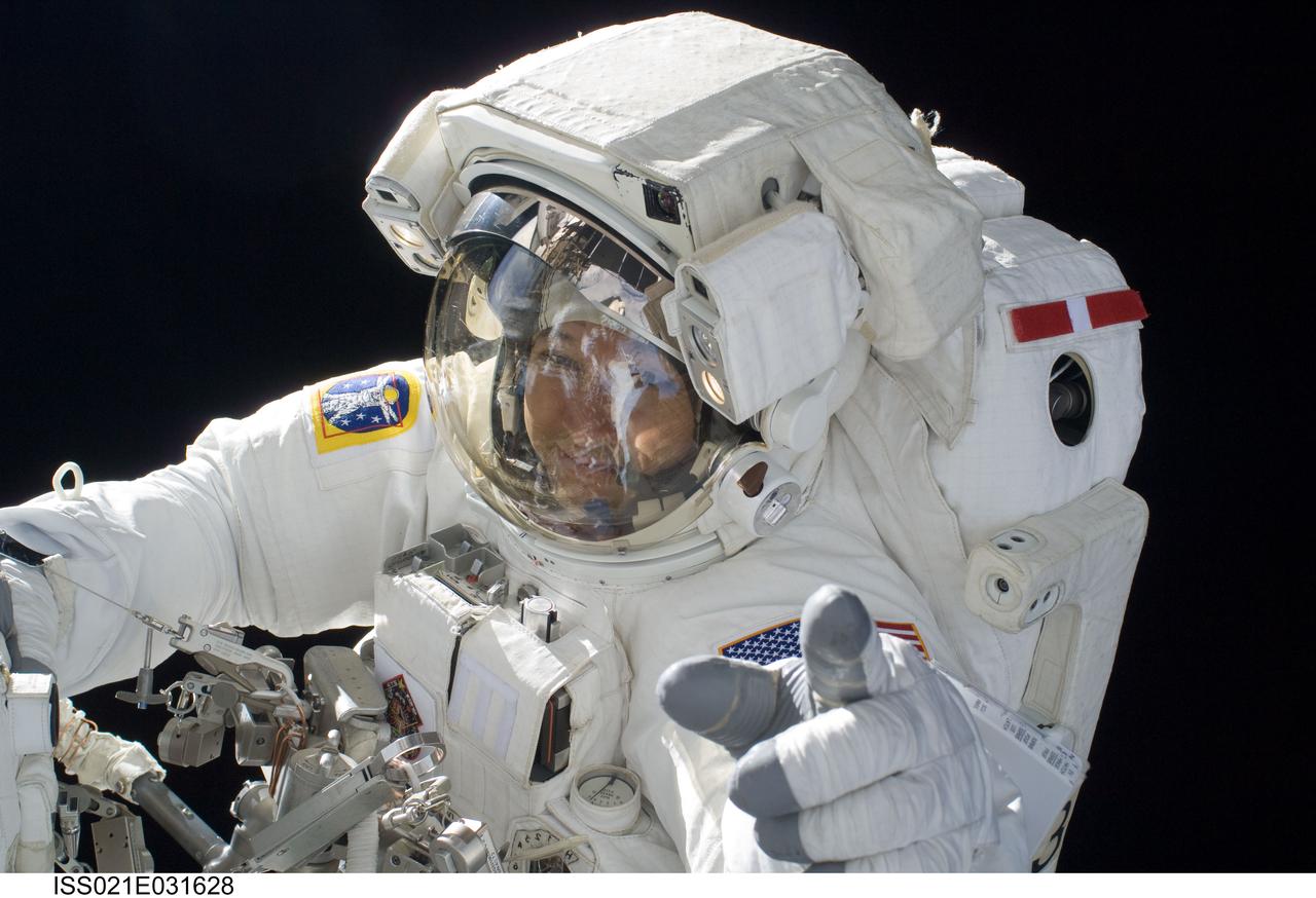 ISS021-E-031628 (23 Nov. 2009) --- Astronaut Randy Bresnik, STS-129 mission specialist, participates in the mission's third and final session of extravehicular activity (EVA) as construction and maintenance continue on the International Space Station. During the five-hour, 42-minute spacewalk, Bresnik and Robert L. Satcher Jr. (out of frame), mission specialist, removed a pair of micrometeoroid and orbital debris shields from the Quest airlock and strapped them to the External Stowage Platform #2, then moved an articulating foot restraint to the airlock, and released a bolt on a starboard truss ammonia tank assembly (ATA) in preparation for an STS-131 spacewalk that will replace the ATA.