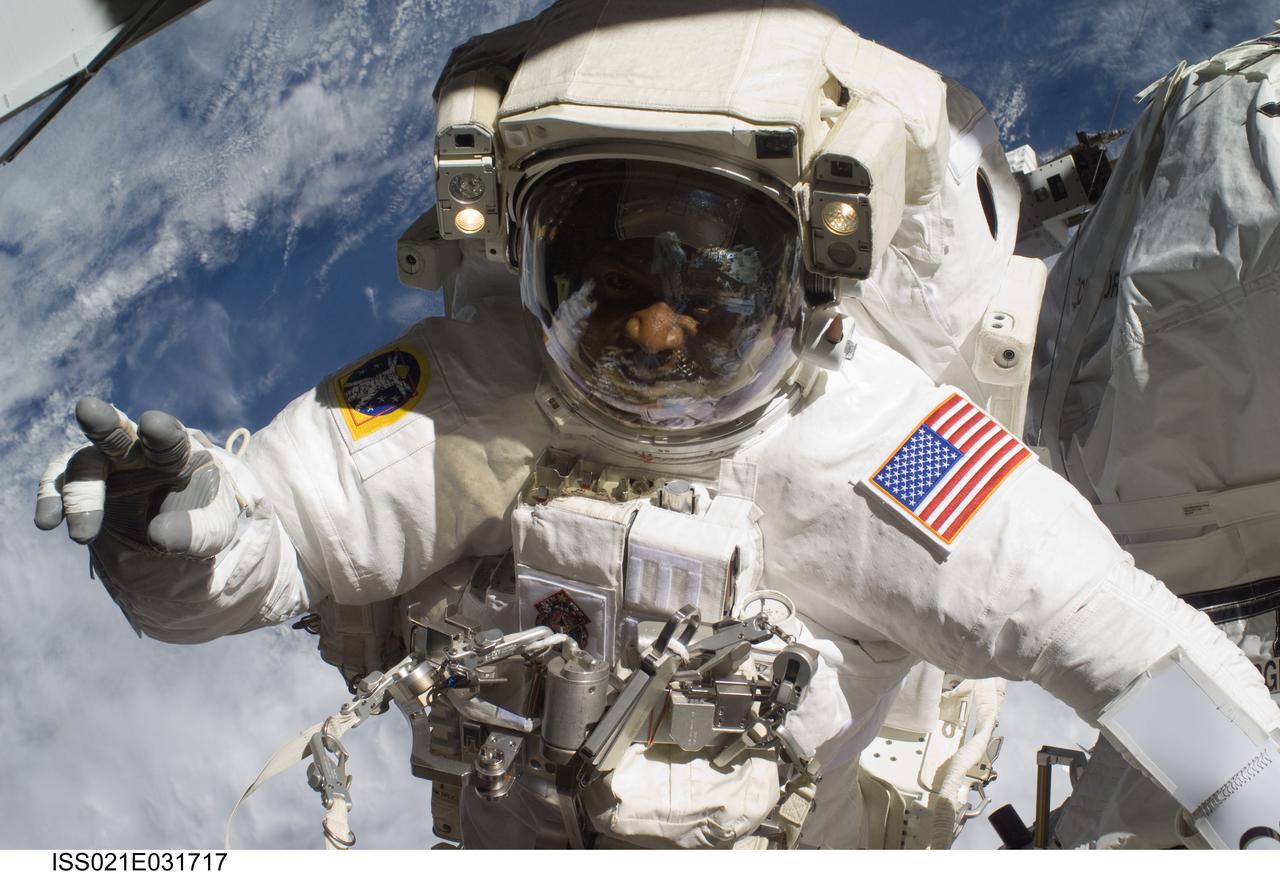 ISS021-E-031717 (23 Nov. 2009) --- Astronaut Robert L. Satcher Jr., STS-129 mission specialist, participates in the mission's third and final session of extravehicular activity (EVA) as construction and maintenance continue on the International Space Station. During the five-hour, 42-minute spacewalk, Satcher and astronaut Randy Bresnik (out of frame), mission specialist, removed a pair of micrometeoroid and orbital debris shields from the Quest airlock and strapped them to the External Stowage Platform #2, then moved an articulating foot restraint to the airlock, and released a bolt on a starboard truss ammonia tank assembly (ATA) in preparation for an STS-131 spacewalk that will replace the ATA.