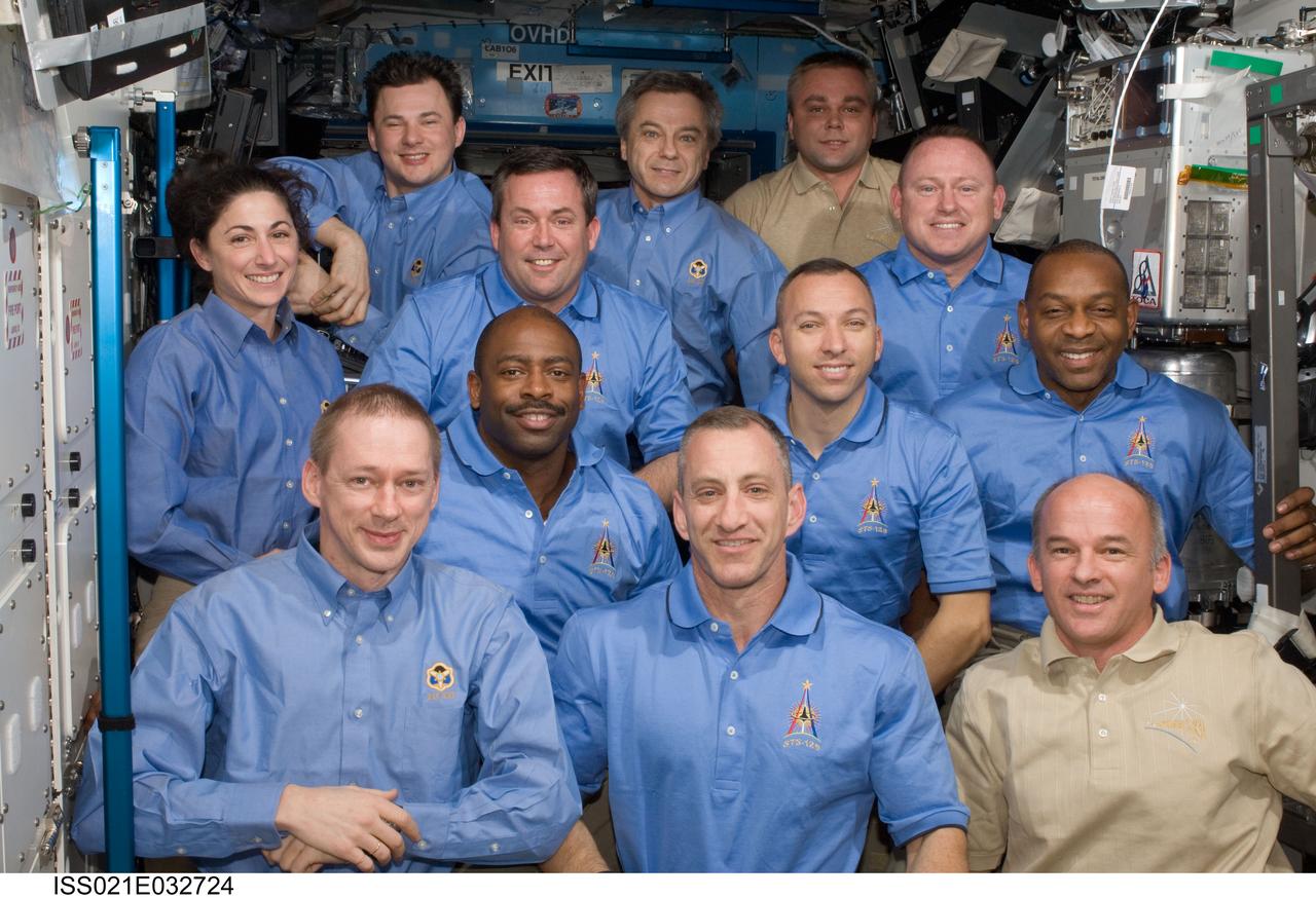 ISS021-E-032724 (24 Nov. 2009) --- One of the last occasions for these twelve internationally-represented astronauts and cosmonauts to spend time together in space was topped off with a series of group portraits aboard the International Space Station.  The group includes the seven STS-129 Atlantis astronauts Charles O. Hobaugh, commander; Barry E. Wilmore, pilot; and Nicole Stott, Mike Foreman, Leland Melvin, Robert L. Satcher Jr. and Randy Bresnik, all mission specialists, plus the five ISS crew members, Jeffrey Williams, the European Space Agency’s Frank De Winne, the Canadian Space agency’s Robert Thirsk and Russia’s Federal Space Agency cosmonauts Roman Romanenko and Maxim Suraev. The dozen are wrapping up almost a full week sharing duties, tasks and chores aimed toward complete development of the orbital outpost.
