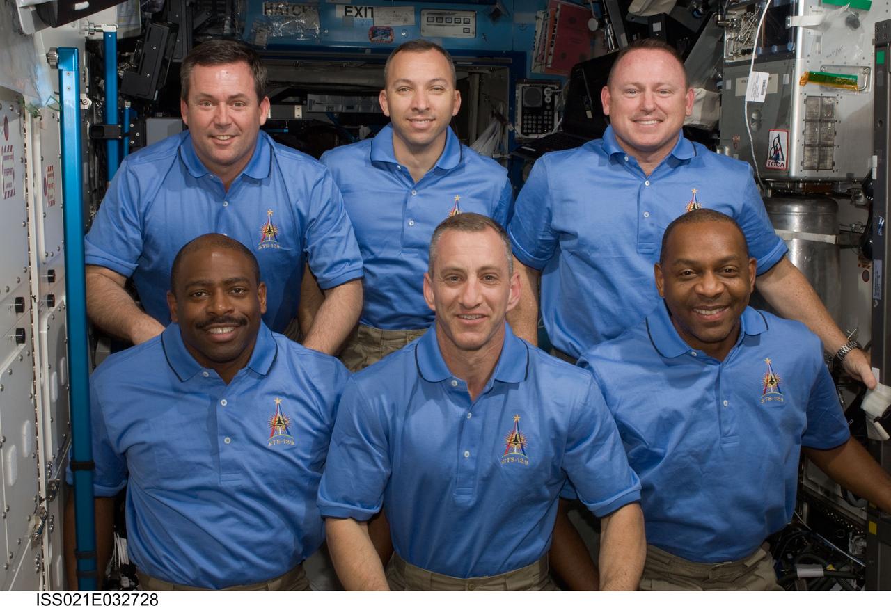 ISS021-E-032728 (24 Nov. 2009) --- STS-129 crew members pose for a portrait following a joint news conference with the Expedition 21 crew members (out of frame) from the Destiny laboratory of the International Space Station while space shuttle Atlantis remains docked with the station. Pictured on the front row are astronauts Charles O. Hobaugh (center), commander; along with Leland Melvin (left) and Robert L. Satcher Jr., both mission specialists. Pictured on the back row are astronauts Barry E. Wilmore (right), pilot; along with Mike Foreman (left) and Randy Bresnik, both mission specialists.
