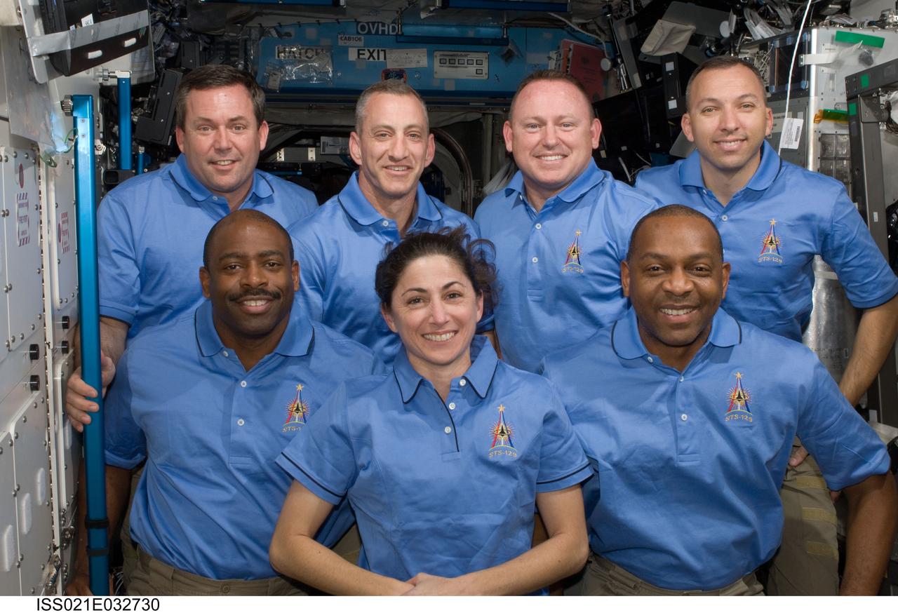 ISS021-E-032730 (24 Nov. 2009) --- One of the last occasions for the twelve internationally-represented astronauts and cosmonauts to spend time together in space was topped off with a series of group portraits aboard the International Space Station. This group, who will soon be departing, includes the seven STS-129 Atlantis astronauts Charles O. Hobaugh (second left, back row), commander; Barry E. Wilmore (second right, back row), pilot; and left to right on the front row: Leland Melvin, Nicole Stott and Robert L. Satcher Jr., all mission specialists. Also, Mike Foreman and Randy Bresnik, (left and right, respectively on the back row) mission specialists. Later, they will be saying their farewells to NASA astronaut Jeffrey Williams, the European Space Agency’s Frank De Winne, the Canadian Space agency’s Robert Thirsk and Russia’s Federal Space Agency cosmonauts Roman Romanenko and Maxim Suraev (all out of frame), who will remain onboard the orbital outpost.