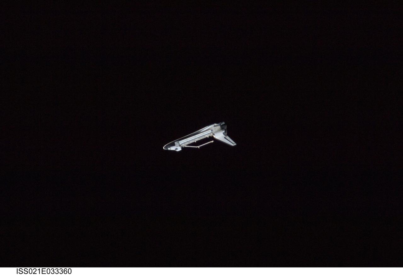 ISS021-E-033360 (25 Nov. 2009) --- Surrounded by the blackness of space, this profile view of the space shuttle Atlantis was photographed by an Expedition 21 crew member on the International Space Station soon after the shuttle and station began their post-undocking relative separation. Undocking of the two spacecraft occurred at 3:53 a.m. (CST) on Nov. 25, 2009.