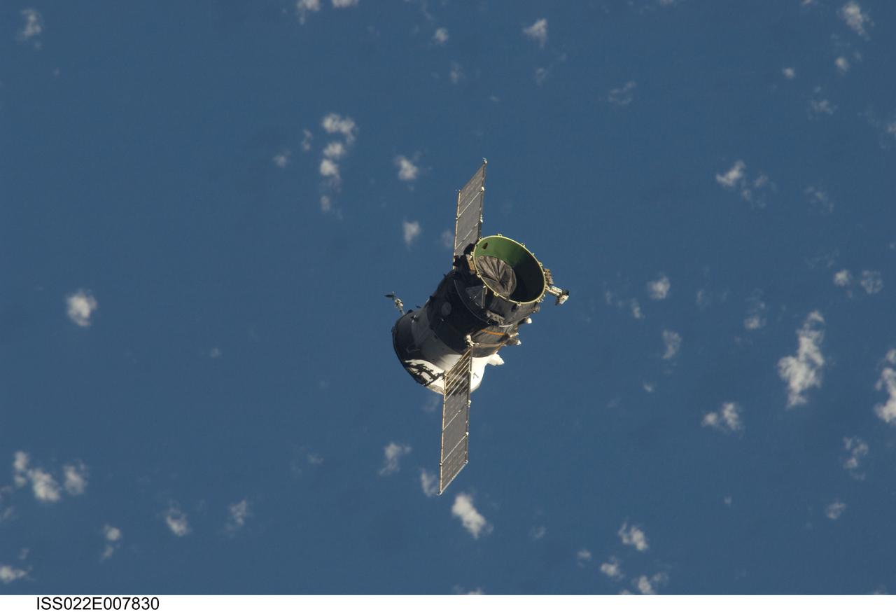 ISS022-E-007830 (7 Dec. 2009) --- The propulsion compartment of the Poisk Mini-Research Module 2 (MRM2) departs from the International Space Station and was deorbited four hours later for a destructive reentry in Earth?s atmosphere. The undocking occurred at 6:16 p.m. (CST) on Dec. 7, 2009. Its departure opens up a docking port for Russian vehicles on Poisk, which will first be used when NASA astronaut Jeffrey Williams, Expedition 22 commander; and Russian cosmonaut Maxim Suraev, flight engineer, relocate their Soyuz spacecraft in January 2010.