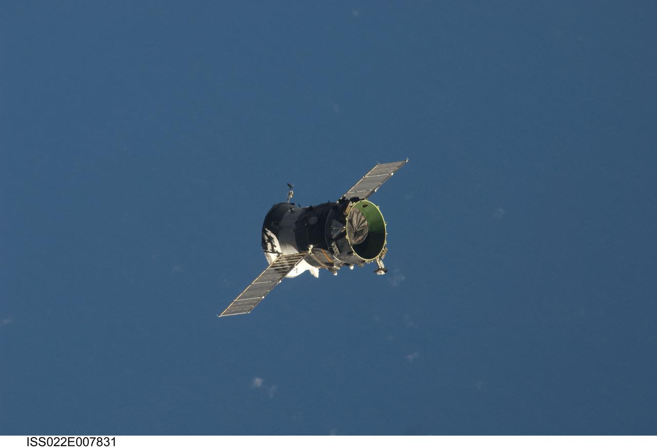 ISS022-E-007831 (7 Dec. 2009) --- The propulsion compartment of the Poisk Mini-Research Module 2 (MRM2) departs from the International Space Station and was deorbited four hours later for a destructive reentry in Earth?s atmosphere. The undocking occurred at 6:16 p.m. (CST) on Dec. 7, 2009. Its departure opens up a docking port for Russian vehicles on Poisk, which will first be used when NASA astronaut Jeffrey Williams, Expedition 22 commander; and Russian cosmonaut Maxim Suraev, flight engineer, relocate their Soyuz spacecraft in January 2010.