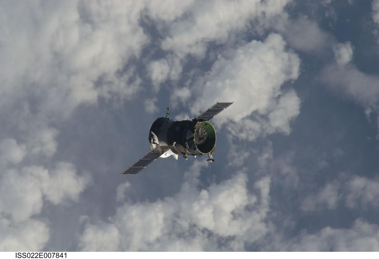 ISS022-E-007841 (7 Dec. 2009) --- The propulsion compartment of the Poisk Mini-Research Module 2 (MRM2) departs from the International Space Station and was deorbited four hours later for a destructive reentry in Earth?s atmosphere. The undocking occurred at 6:16 p.m. (CST) on Dec. 7, 2009. Its departure opens up a docking port for Russian vehicles on Poisk, which will first be used when NASA astronaut Jeffrey Williams, Expedition 22 commander; and Russian cosmonaut Maxim Suraev, flight engineer, relocate their Soyuz spacecraft in January 2010.