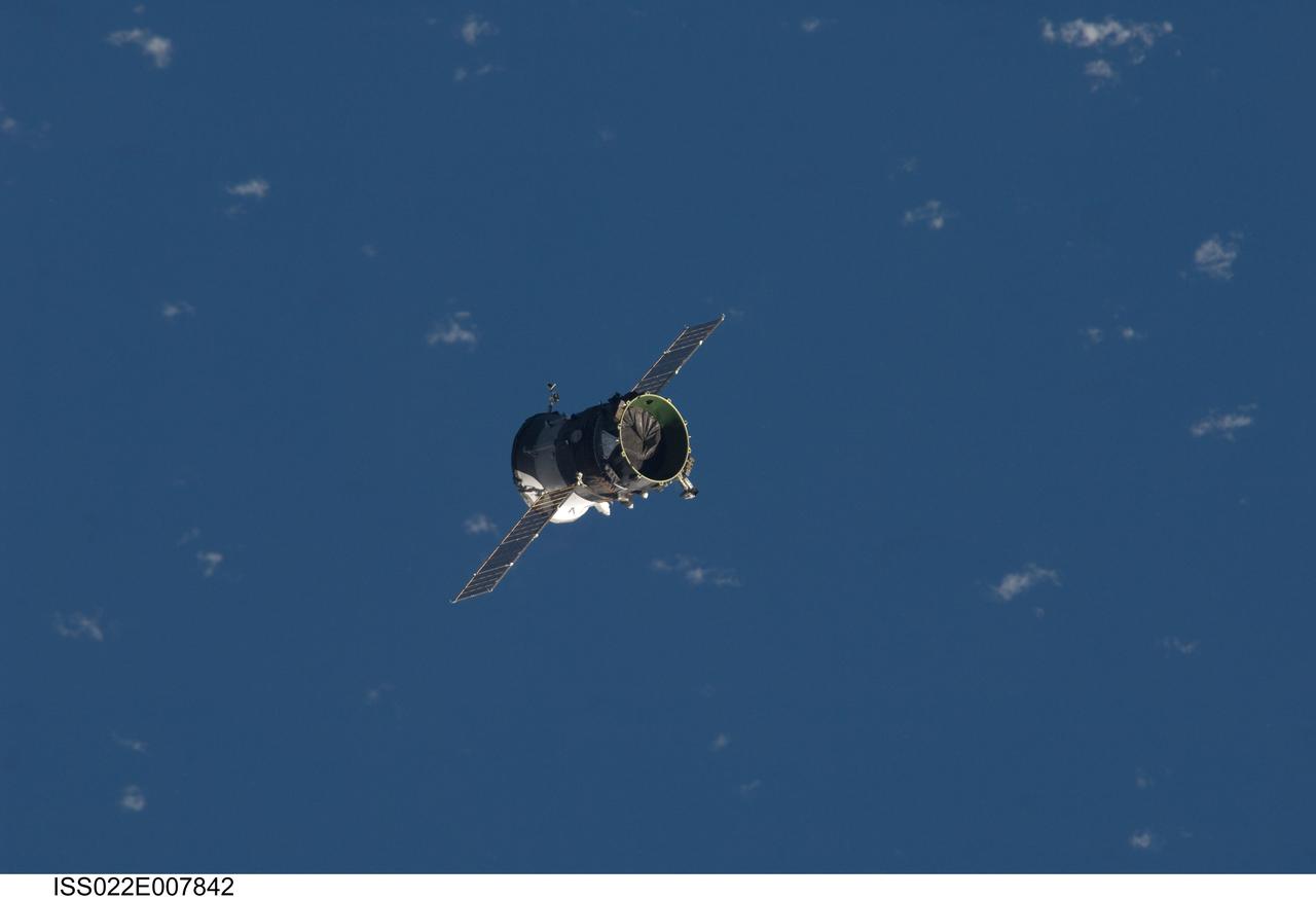 ISS022-E-007842 (7 Dec. 2009) --- The propulsion compartment of the Poisk Mini-Research Module 2 (MRM2) departs from the International Space Station and was deorbited four hours later for a destructive reentry in Earth?s atmosphere. The undocking occurred at 6:16 p.m. (CST) on Dec. 7, 2009. Its departure opens up a docking port for Russian vehicles on Poisk, which will first be used when NASA astronaut Jeffrey Williams, Expedition 22 commander; and Russian cosmonaut Maxim Suraev, flight engineer, relocate their Soyuz spacecraft in January 2010.