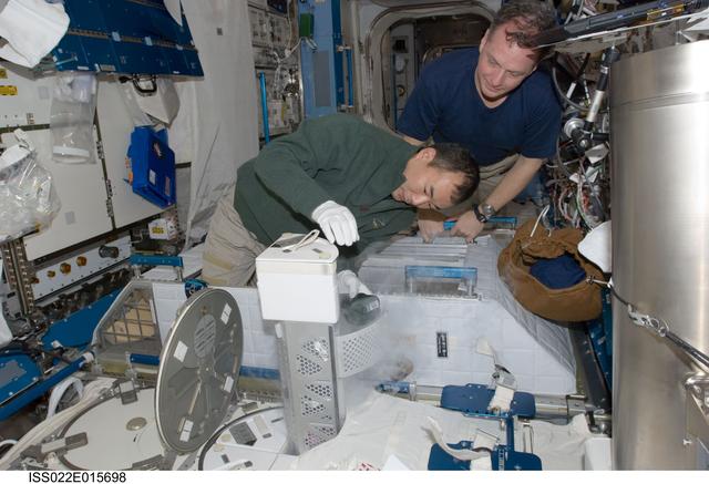 NASA image: Noguchi and Creamer service the MELFI-1 in the JEM during Expedition 22