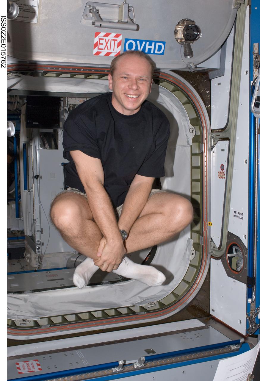 ISS022-E-015762 (24 Dec. 2009) --- Russian cosmonaut Oleg Kotov, Expedition 22 flight engineer, poses for a photo in the Harmony node of the International Space Station.
