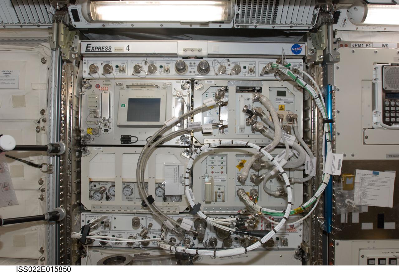 iss022e015850 (12/30/2009) --- The image shows a front view of EXpedite the PRocessing of Experiments to Space Station EXPRESS Rack 4 (Rack 4,JPM/1F5) in the Japanese Experiment Module (JEM) Japanese Pressurized Module (JPM). Equipment visible in the EXPRESS Rack includes the Biotechnology Specimen Temperature Controller (BSTC) and the Gas Supply Module (GSM) support hardware for the CBOSS (Cellular Biotechnology Operations Support Systems) investigations, and the Device for the Study of Critical Liquids and Crystallization (DECLIC).