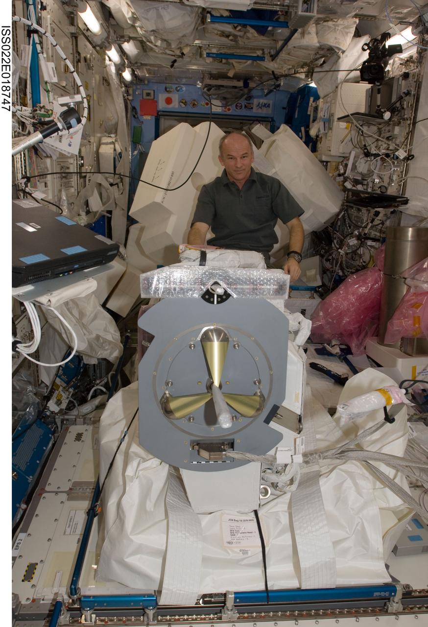 ISS022-E-018747 (5 Jan. 2010) --- NASA astronaut Jeffrey Williams, Expedition 22 commander, assembles and configures the Japanese Experiment Module Remote Manipulator System (JEMRMS) Small Fine Arm (SFA) in the Kibo laboratory of the International Space Station.