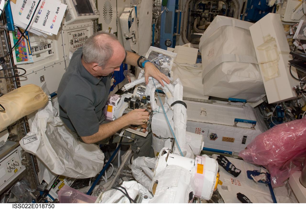 ISS022-E-018750 (5 Jan. 2010) --- NASA astronaut Jeffrey Williams, Expedition 22 commander, assembles and configures the Japanese Experiment Module Remote Manipulator System (JEMRMS) Small Fine Arm (SFA) in the Kibo laboratory of the International Space Station.