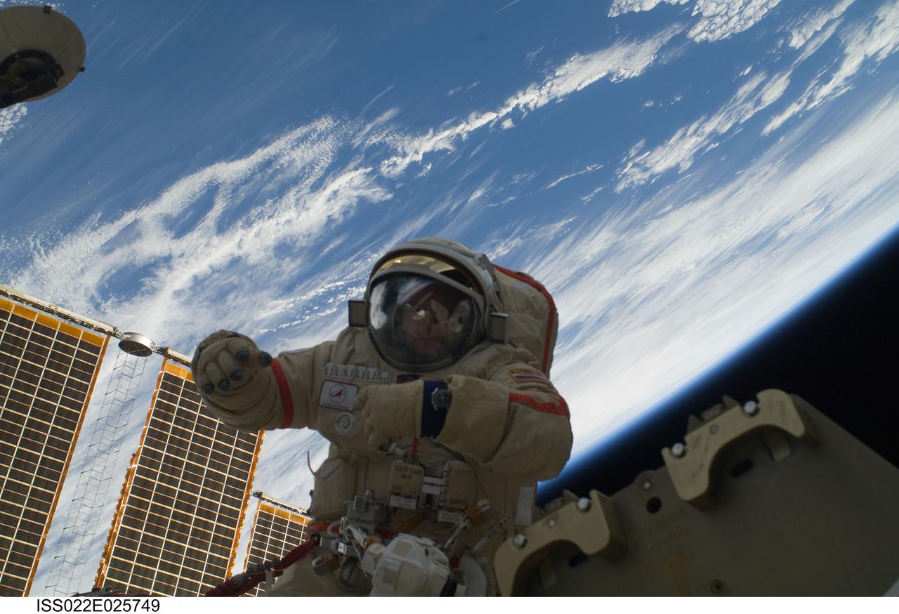 ISS022-E-025749 (14 Jan. 2010) --- Russian cosmonauts Oleg Kotov and Maxim Suraev (out of frame), both Expedition 22 flight engineers, participate in a session of extravehicular activity (EVA) as maintenance and construction continue on the International Space Station. During the spacewalk, Kotov and Suraev prepared the Mini-Research Module 2 (MRM2), known as Poisk, for future Russian vehicle dockings. Suraev and NASA astronaut Jeffrey Williams, commander, will be the first to use the new docking port when they relocate their Soyuz TMA-16 spacecraft from the aft port of the Zvezda Service Module on Jan. 21. Earth’s horizon and the blackness of space provide the backdrop for the scene.