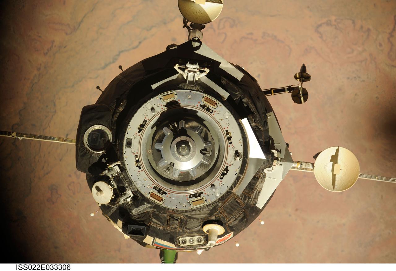 ISS022-E-033306 (21 Jan. 2010) --- The Soyuz TMA-16 spacecraft is featured in this image photographed by an Expedition 22 crew member on the International Space Station during the relocation of the Soyuz from the Zvezda Service Module’s aft port to the Poisk module. Russian cosmonaut Maxim Suraev, Soyuz commander and Expedition 22 flight engineer; along with NASA astronaut Jeffrey Williams, Expedition 22 commander, undocked the Soyuz spacecraft at 4:03 a.m. (CST) and docked it to Poisk at 4:24 a.m. on Jan. 21, 2010.