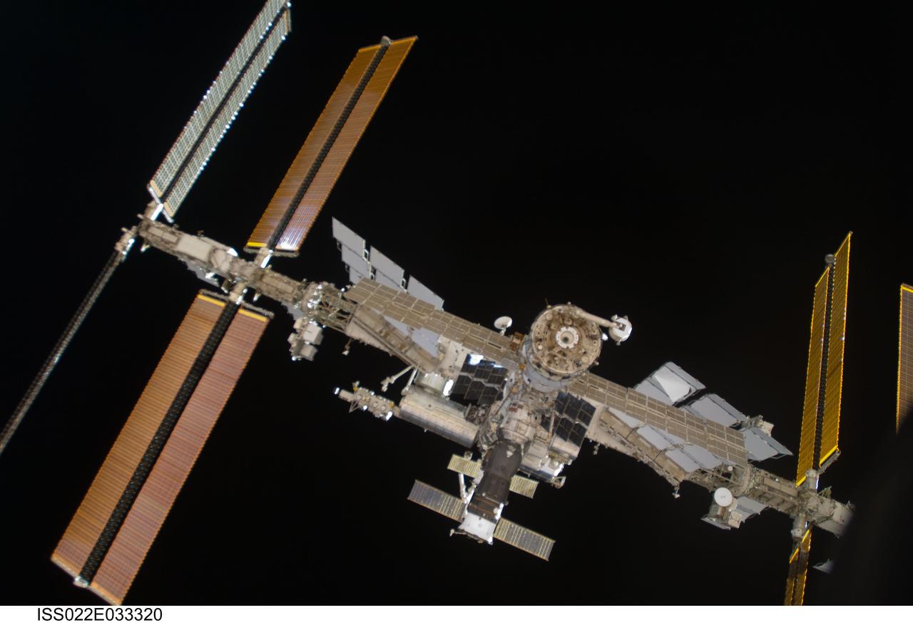 ISS022-E-033320 (21 Jan. 2010) --- The International Space Station is featured in this image photographed by a crew member on the Soyuz TMA-16 spacecraft during the relocation of the Soyuz from the Zvezda Service Module’s aft port to the Poisk module. Russian cosmonaut Maxim Suraev, Soyuz commander and Expedition 22 flight engineer; along with NASA astronaut Jeffrey Williams, Expedition 22 commander, undocked the Soyuz spacecraft at 4:03 a.m. (CST) and docked it to Poisk at 4:24 a.m. on Jan. 21, 2010.