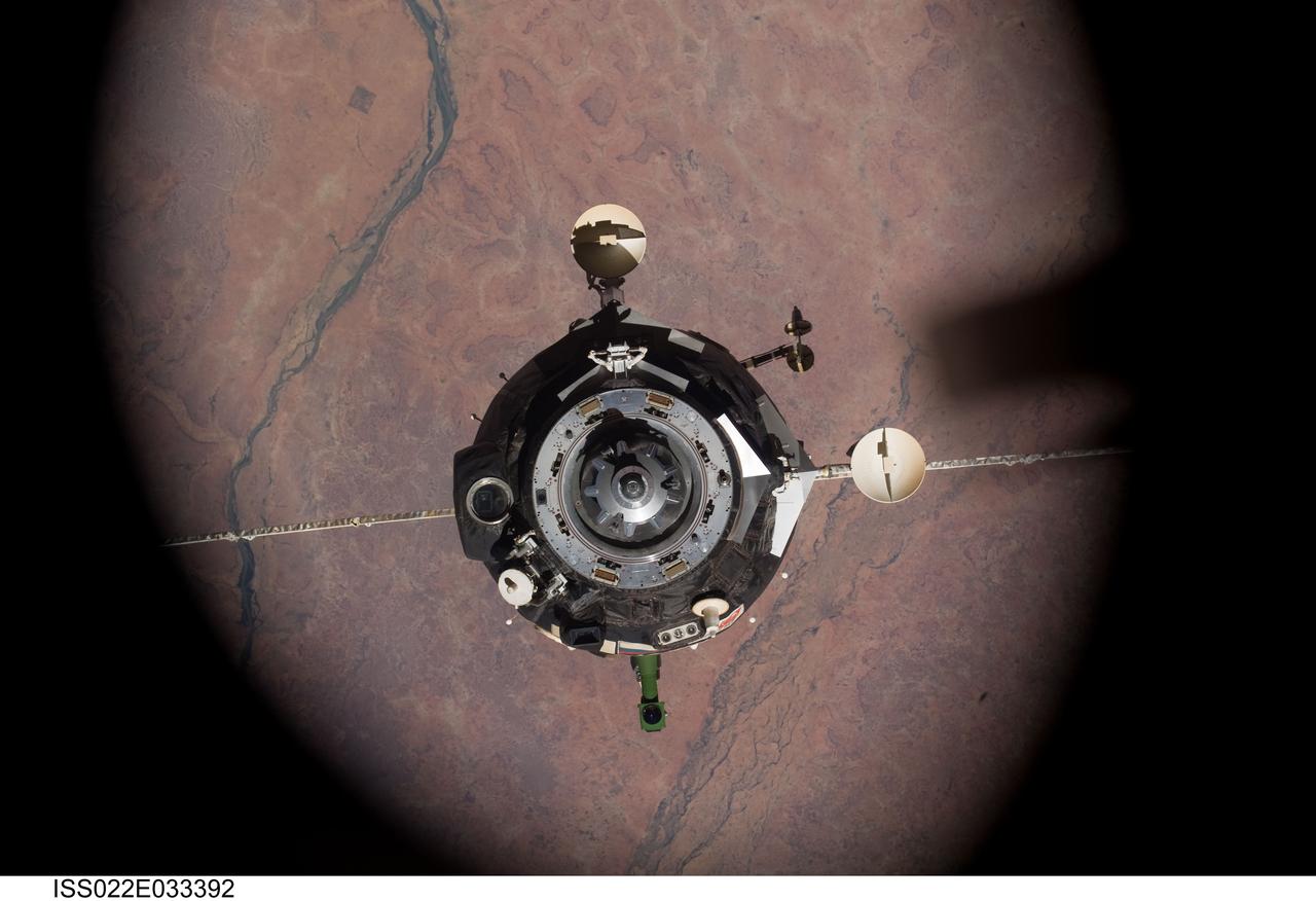 ISS022-E-033392 (21 Jan. 2010) --- The Soyuz TMA-16 spacecraft is featured in this image photographed by an Expedition 22 crew member on the International Space Station during the relocation of the Soyuz from the Zvezda Service Module’s aft port to the Poisk module. Russian cosmonaut Maxim Suraev, Soyuz commander and Expedition 22 flight engineer; along with NASA astronaut Jeffrey Williams, Expedition 22 commander, undocked the Soyuz spacecraft at 4:03 a.m. (CST) and docked it to Poisk at 4:24 a.m. on Jan. 21, 2010.